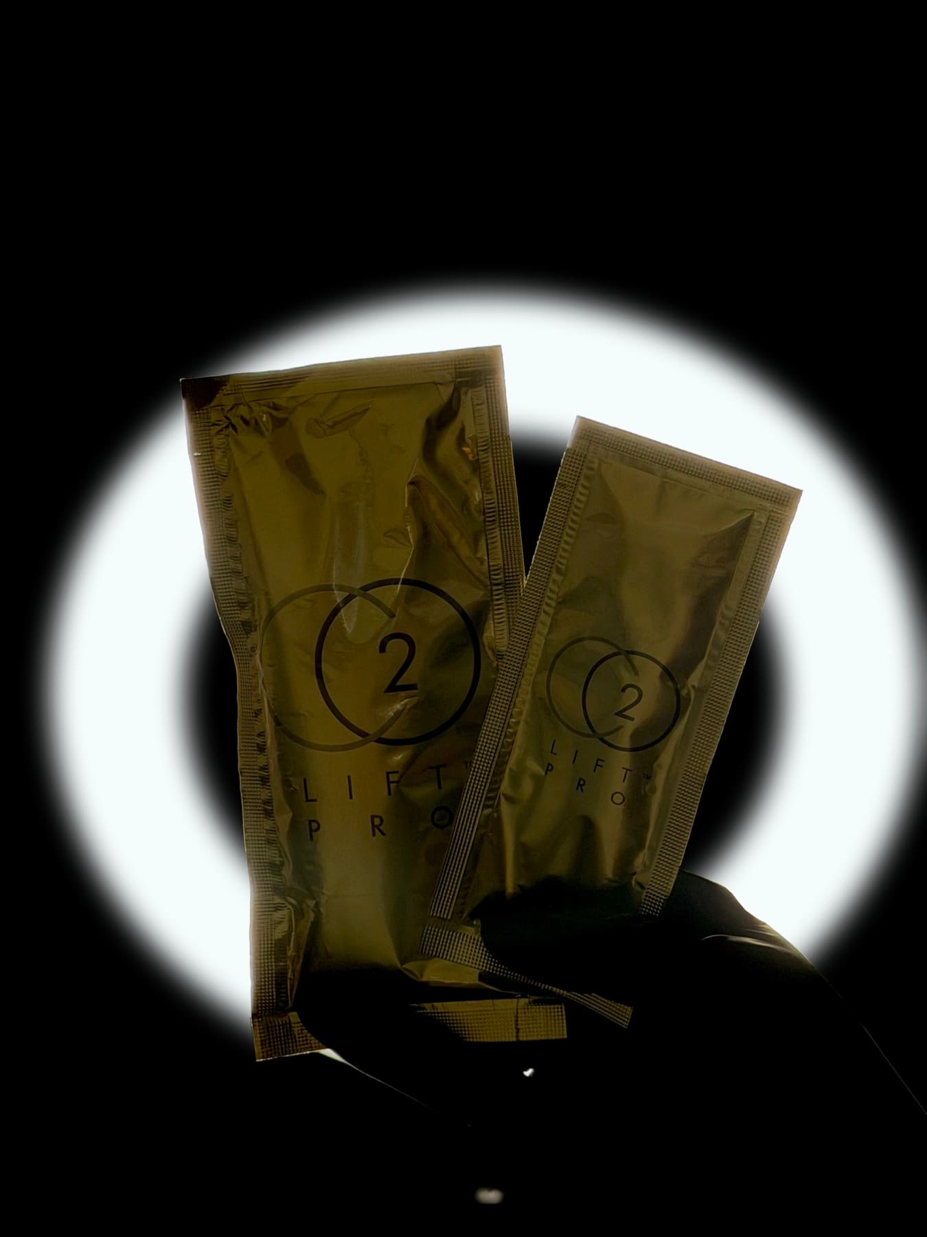 Two CO₂Lift Pro carboxy mask sachets held up at The Skin Room
